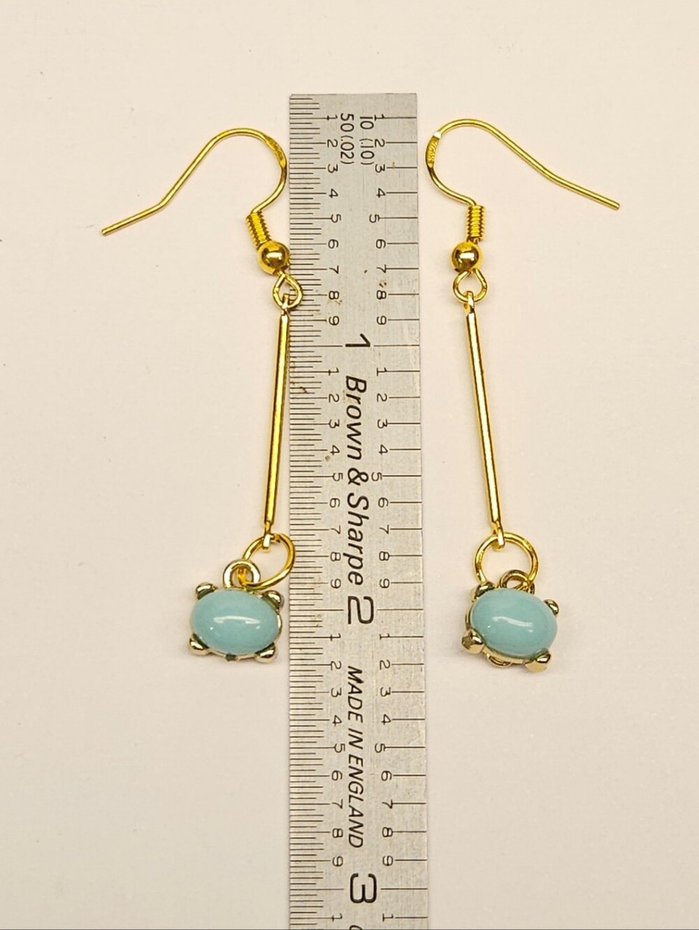 Gold-Tone Drop Earrings with Light Blue Colored Gemstones - Picture 5 of 5